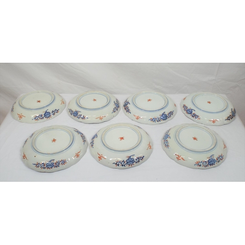 167 - Set of seven Imari plates with wavy rims, burnt ochre and deep blue and yellow foliate decoration