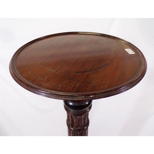 171 - Victorian mahogany torchere or plant stand with raised rim, reeded foliate decorated column, on hipp... 