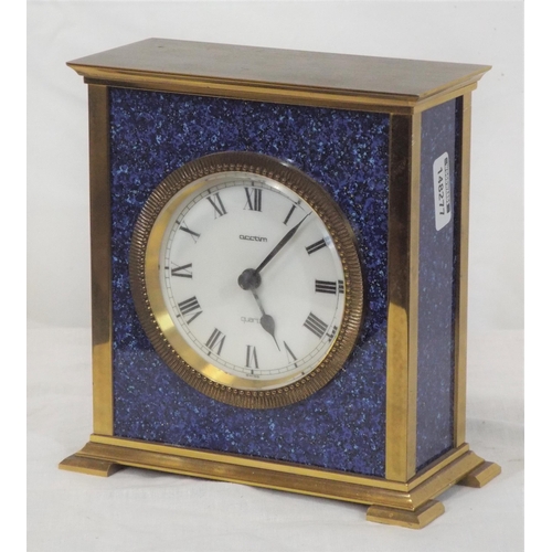 174 - Brass cased clock with brass framed enamel dial on bracket