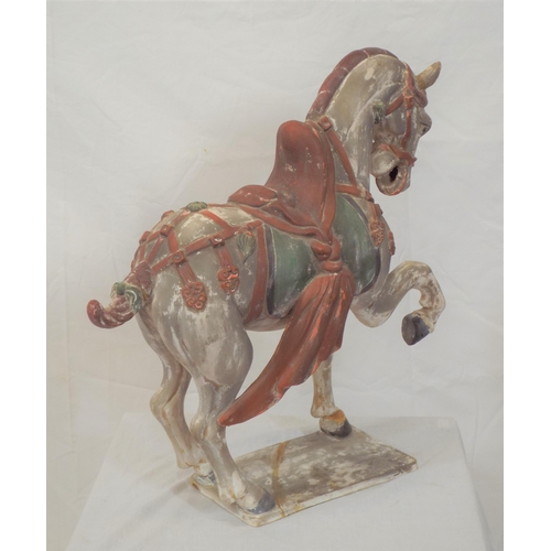 189 - Ornate terracotta figure of a horse on oblong stand