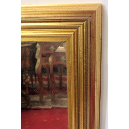 196 - Long bevelled glass wall mirror with gilt frame