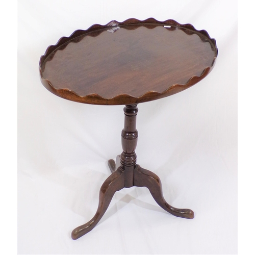 269 - Victorian mahogany oval occasional table with wavy border, vase turned column, on hipped tripod with... 