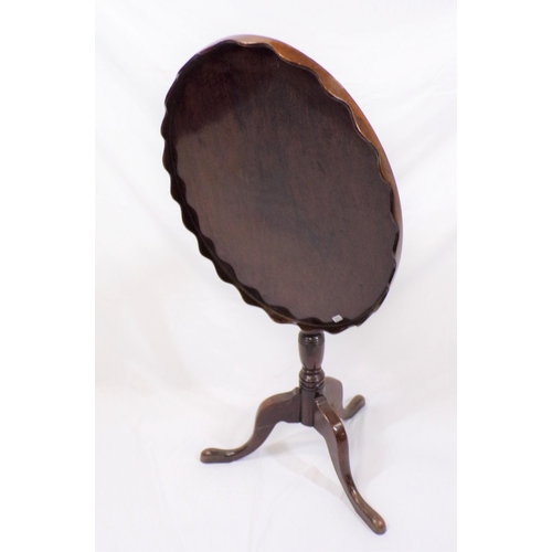 269 - Victorian mahogany oval occasional table with wavy border, vase turned column, on hipped tripod with... 