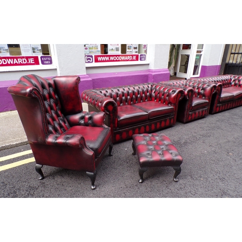 350 - 7 piece lounge suite with red leather button back upholstery, brass pins, 2 wingback armchairs, 3 se... 