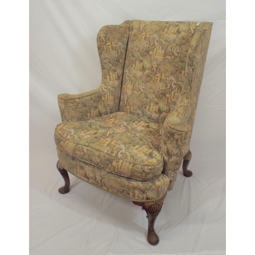 353 - Georgian wingback armchair with heraldic upholstery, on cabriole legs with shell knees and pad feet