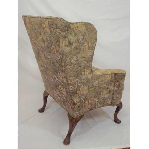 353 - Georgian wingback armchair with heraldic upholstery, on cabriole legs with shell knees and pad feet