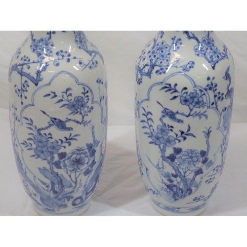 43 - Pair of Asian baluster shaped flower vases with blue and white foliate and bird decoration