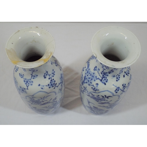 43 - Pair of Asian baluster shaped flower vases with blue and white foliate and bird decoration