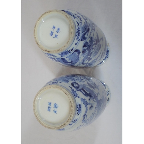 43 - Pair of Asian baluster shaped flower vases with blue and white foliate and bird decoration