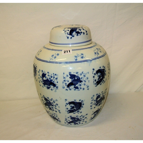 67 - Dutch delft style baluster shaped ginger jar with round lid and fish decoration