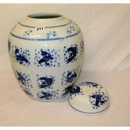 67 - Dutch delft style baluster shaped ginger jar with round lid and fish decoration