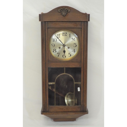 83 - Oak case wall clock with round brass framed silvered dial and pendulum, and bevelled glass insets