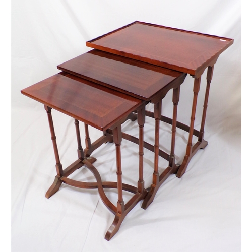 99 - Edwardian inlaid mahogany nest of three tables on spindle columns with bracket feet