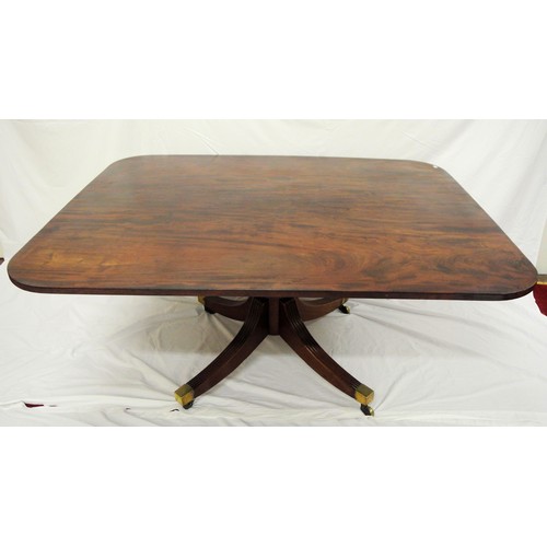 100 - Georgian mahogany library or dining table with tip-up top, rounded corners, raised on turned taperin... 