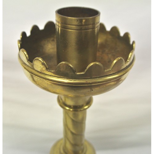 242 - Pair of Victorian brass candlesticks with wavy rims, round bases, on cast feet