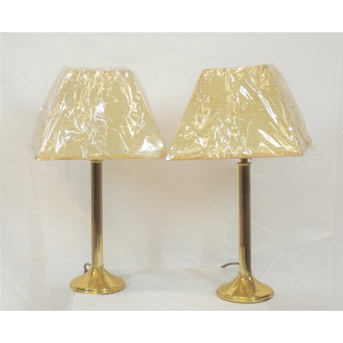 177 - Pair of brass table lamps with reeded columns and round bases