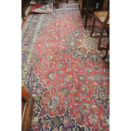 111 - Large red ground hand woven Persian Mashad carpet traditional floral design 395x 295cm