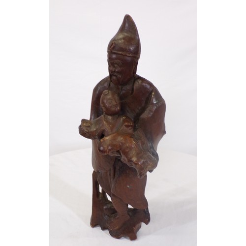 34 - Carved figure of an Asian man with child