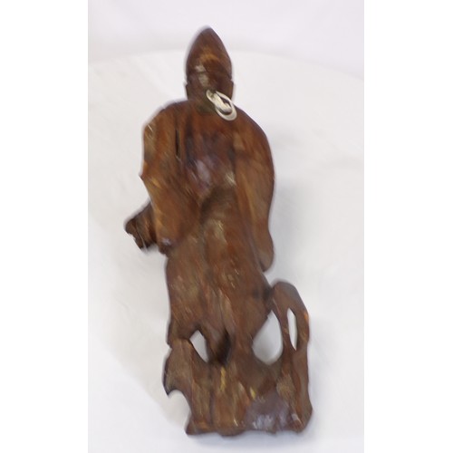 34 - Carved figure of an Asian man with child