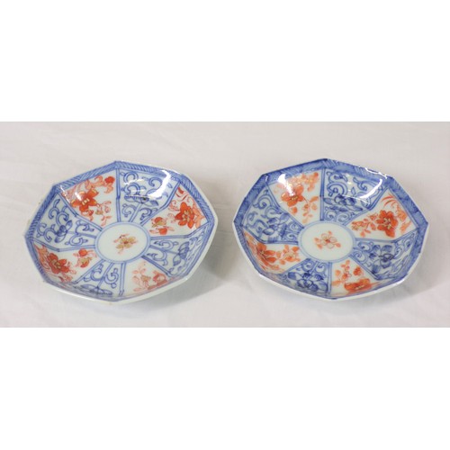 265 - Pair of Asian small bowls of hexagonal form with blue and ochre decoration