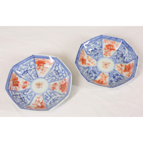 265 - Pair of Asian small bowls of hexagonal form with blue and ochre decoration