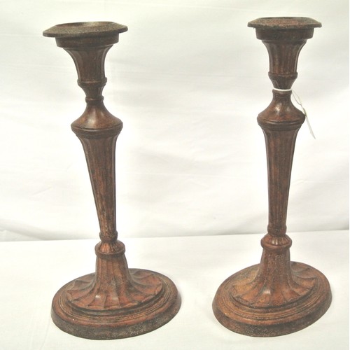 248 - Pair of metal candlesticks with reeded columns on oval bases