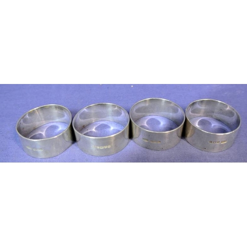 116 - Three Birmingham and one Chester silver round napkin rings, Birmingham 1908 and 1845 121g