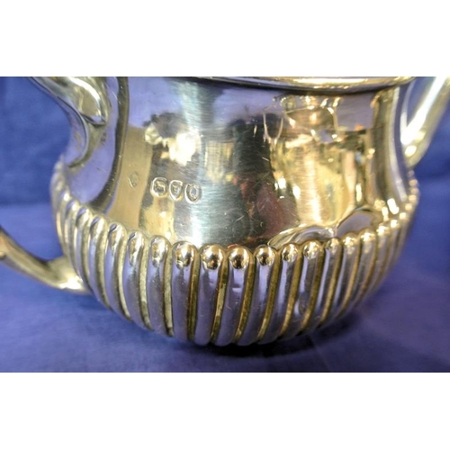 118 - Victorian London silver oval teapot with lower body reeding, shaped handle and spout, on oval base, ... 