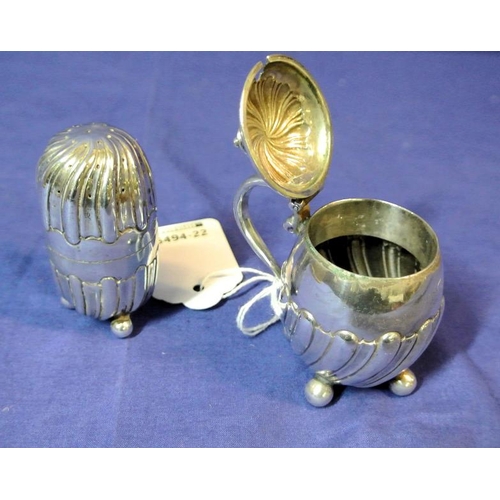 120 - London silver mustard pot and pepperette, fluted decoration, shaped handle and ball feet, dated 1891... 