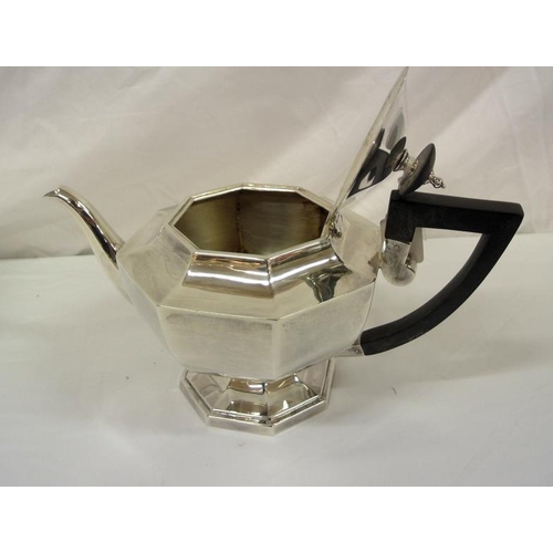 131 - Sheffield silver hexagonal shaped tea pot of bulbous panelled form, with shaped handle and spout, on... 