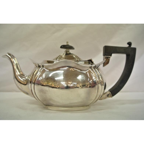 151 - Edward VII Birmingham silver oval teapot with wavy top and shaped corners, shaped handle and spout, ... 