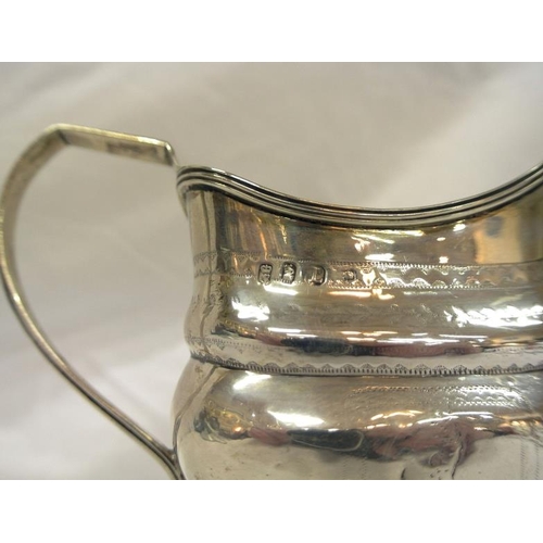 207 - Irish silver cream jug with reeded shaped rim, shaped handle, crested decoration, Dublin 1953, 163g