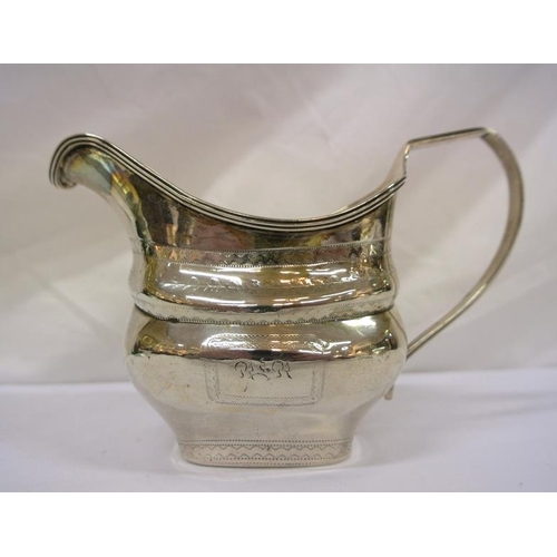 207 - Irish silver cream jug with reeded shaped rim, shaped handle, crested decoration, Dublin 1953, 163g