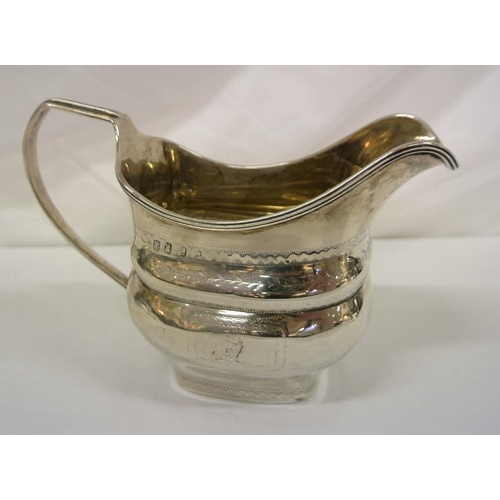 207 - Irish silver cream jug with reeded shaped rim, shaped handle, crested decoration, Dublin 1953, 163g