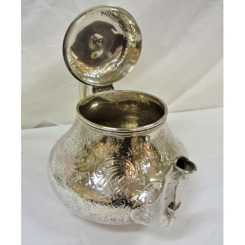 222 - Victorian Irish silver teapot of bulbous form with ornate scroll rococo and foliate decoration, shap... 