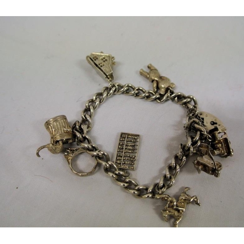 254 - Ornate silverplated charm bracelet, 50g