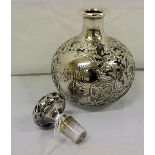 39 - Continental silver decorated and topped ball shaped perfume jar with ornate scroll and foliate decor... 