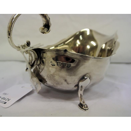 57 - Chester silver boat-shaped sauceboat with wavy rim, shaped handle and hoof feet, dated 1925, 142g