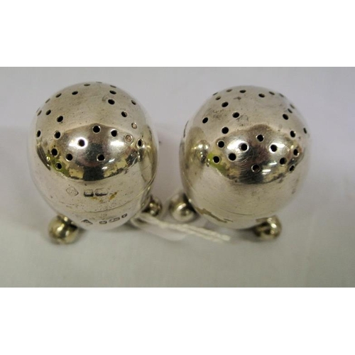 61 - Sheffield silver egg shaped salt and pepper pots with ball legs, dated 1911, 64g