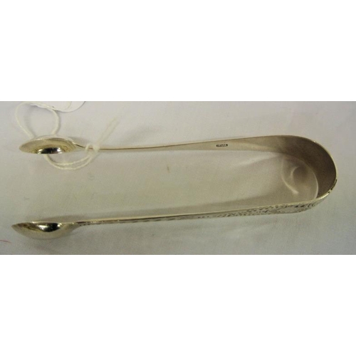 62 - Georgian English silver sugar or ice cube tongs with bright cut decoration and oval grips