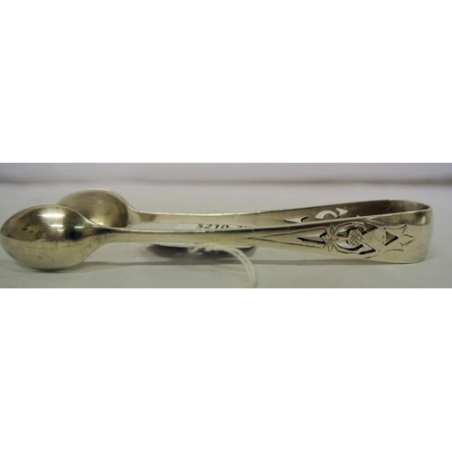 97 - Sheffield silver sugar tongs with thistle decorated pierced handle and oval grips 43g, 12cm