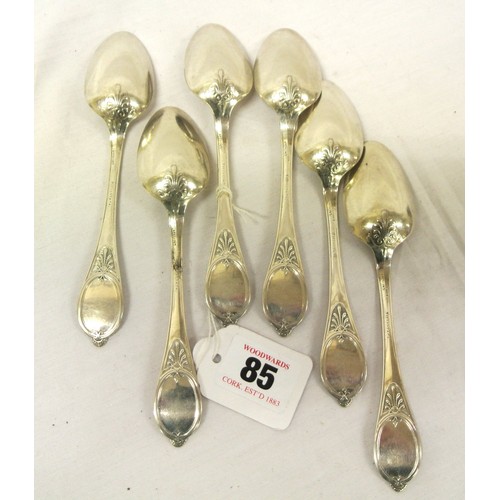 85 - Six dessert spoons with oval decorated handles, stamped 'Tiffany & Co. Sterling 1857', total weight ... 