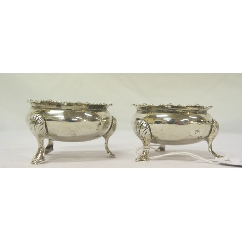 133 - Pair of round Birmingham silver salt cellars with gadroon rims, shell knuckles and pad feet, dated 1... 