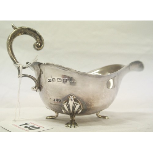 140 - Birmingham silver sauceboat with wavy rim, shaped scroll handle, on claw feet, dated 1939, 169g