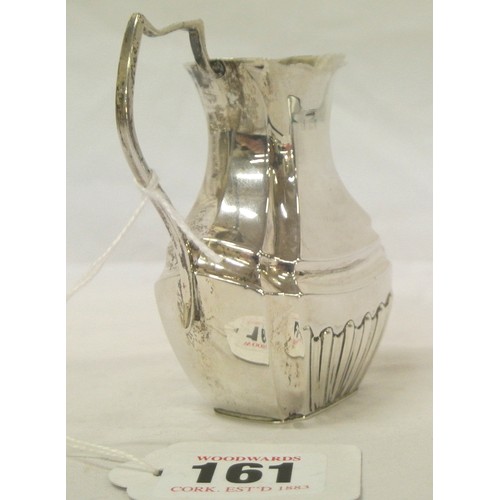 161 - Birmingham silver creamewer of panelled baluster shape, with shaped handle, 59g