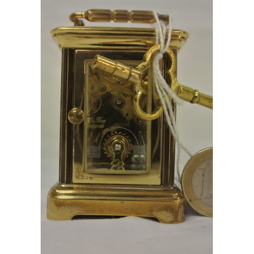 246 - L'Epee miniature Swiss brass cased carriage clock with shaped handle and enamel dial, bevelled glass... 