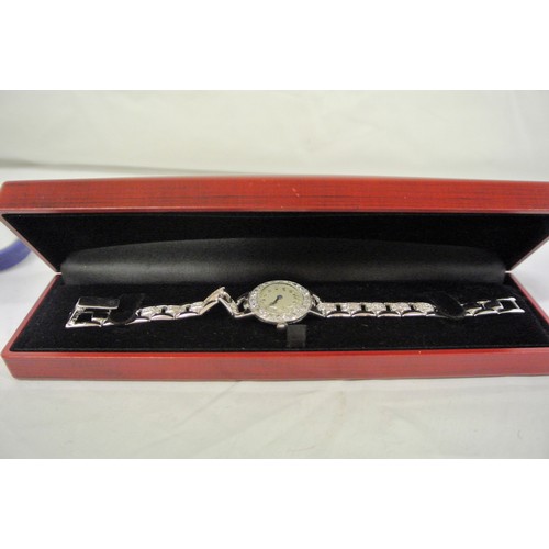 256 - Ladies 9c white gold with diamond   encrusted watch with round face and inscription verso