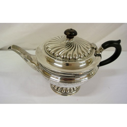 137 - George V London silver teapot of round tapering form with beaded decoration, shaped handle and spout... 