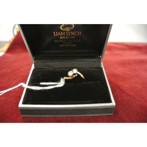 257 - Engagement ring - 18 ct gold twist shank with two round brilliant diamonds