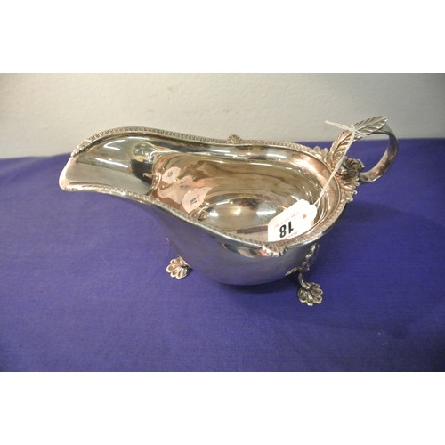 18 - Sheffield silver sauce boat with ornate shell and gadroon rim, foliate decorated handle, shaped legs... 